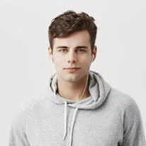 Man wearing earbuds and gray hoodie