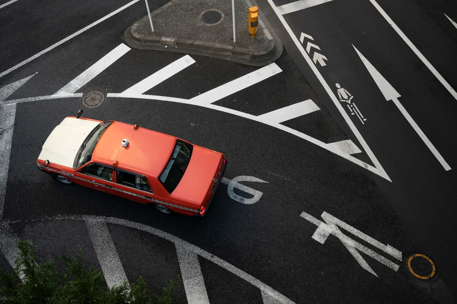Unsafe Turn Car turning at intersection with lane markings, representing unsafe turn.